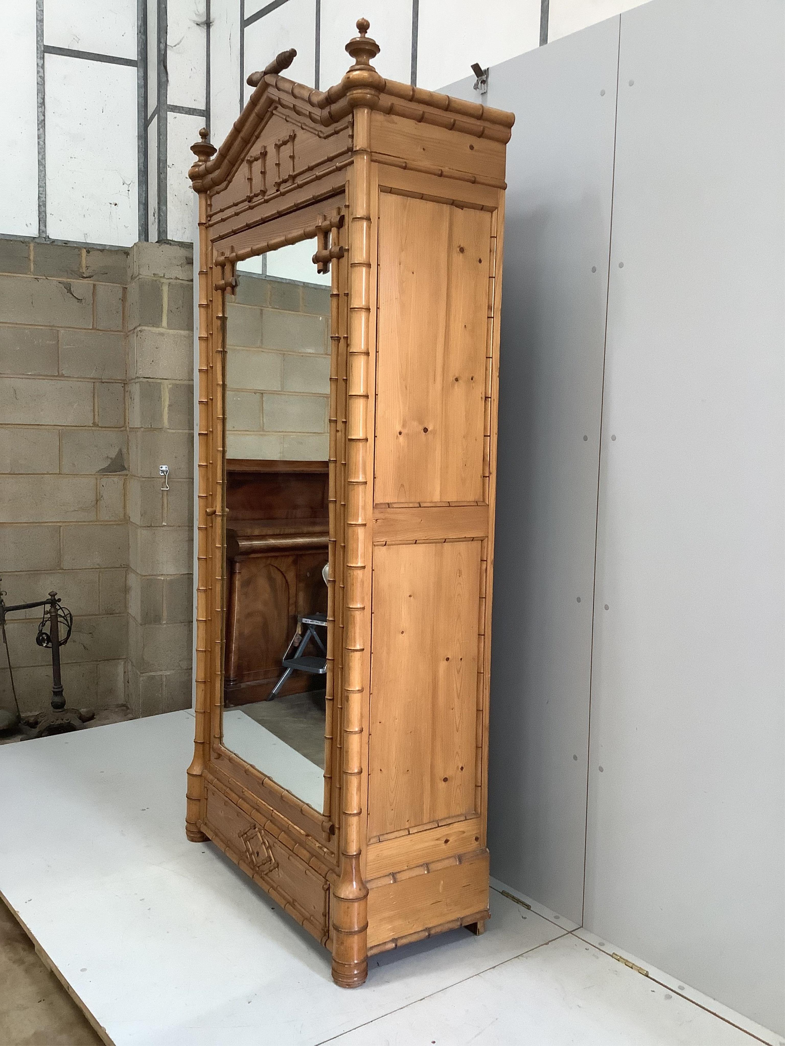 A late Victorian pitch pine faux bamboo mirrored armoire, width 98cm, depth 44cm, height 228cm. Condition - good
